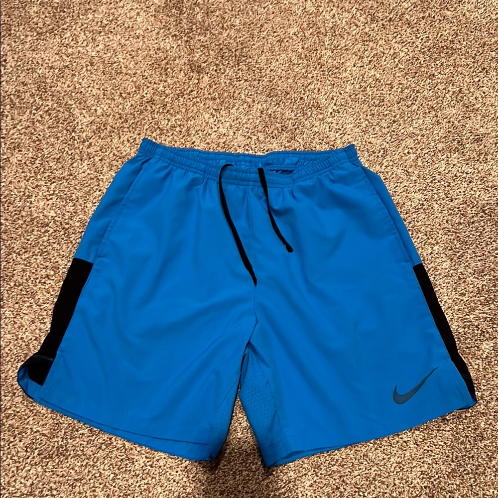 Nike Blue Athletic Shorts with Black Panels and Moisture-Wicking Fabric